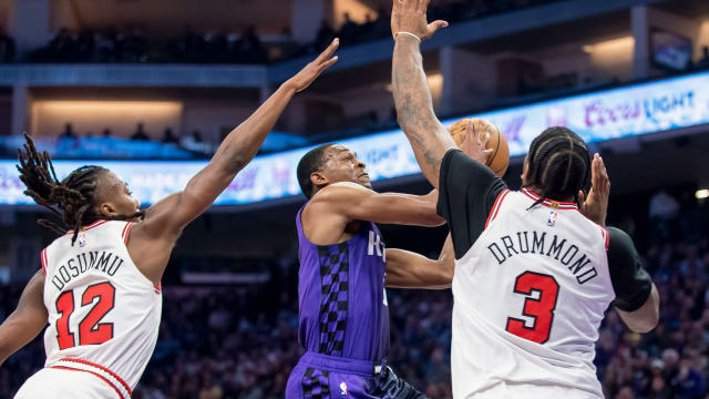 Sacramento Kings guard De'Aaron Fox (5) puts up a shot over Chicago Bulls center Andre Drummond (3) during the second quarter at Golden 1 Center. 